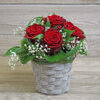 Small red rose arrangement in basket