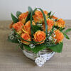 Orange rose arrangement in a basket