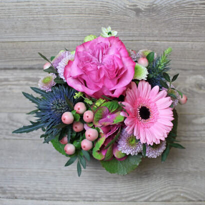 Small pink flower arrangement in the basket