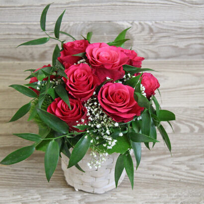 Small pink rose arrangement in basket